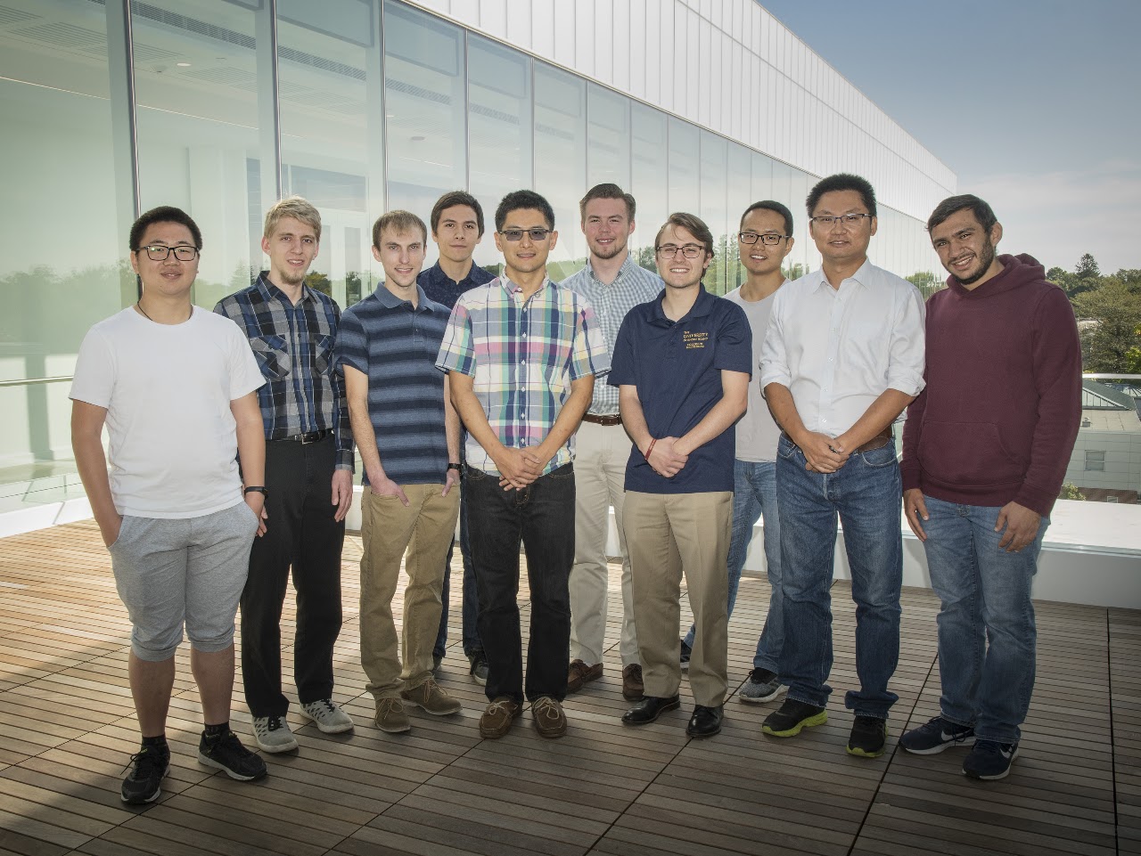 NEXT Lab members gathering on an outdoor deck