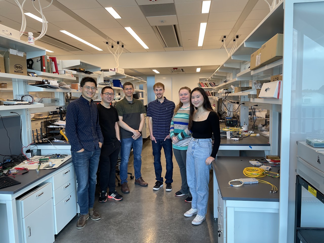 NEXT Lab members smiling in the lab